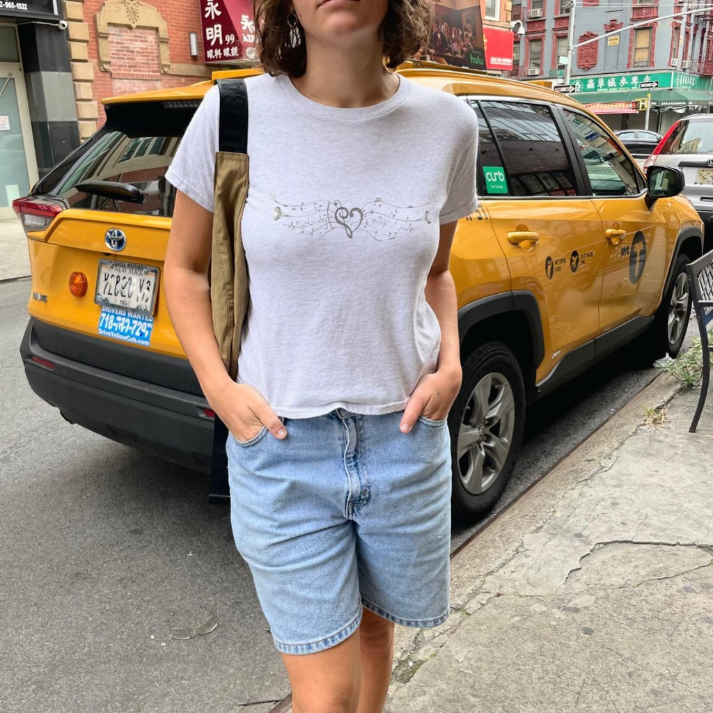 your notes speak to me baby tee